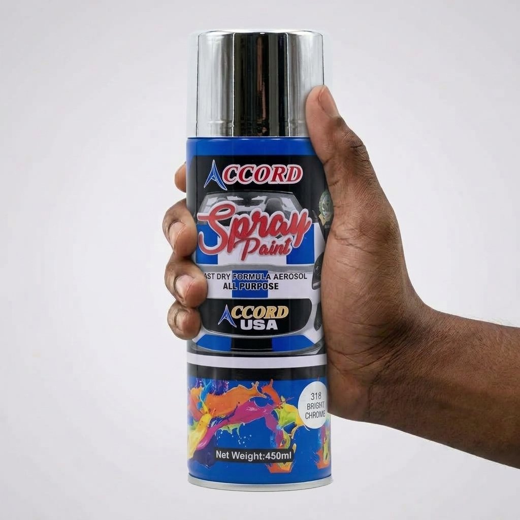 A man holding a can of bright chrome spray paint